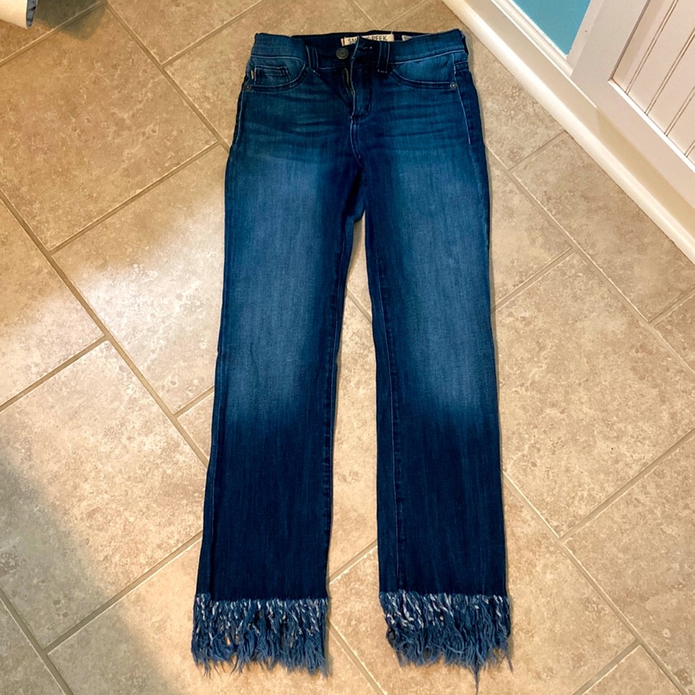 straight legged jeans with frayed ends